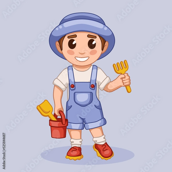 Obraz A boy with a spatula and a bucket for the sandbox