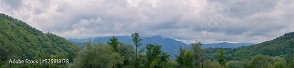 Obraz Wide Panorama Of Wooded Hills Before Rain. Trees On The Mountains. Low Dark Clouds. Nobody. Without People. Wild Places. Summer Landscape.