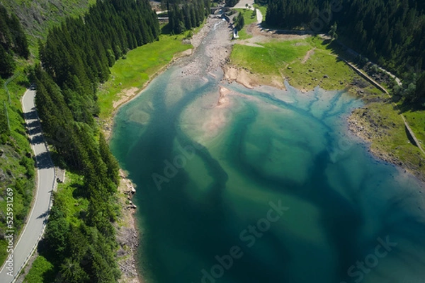 Obraz aerial view of the branches of the lake of paneveggio trentino and bridge in the background
