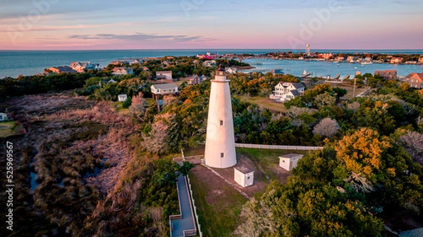 Obraz Ocracoke Lighthouse on Ocracoke , North Carolina at sunset.The lighthouse was built to help guide ships through Ocracoke Inlet into Pamlico Sound.