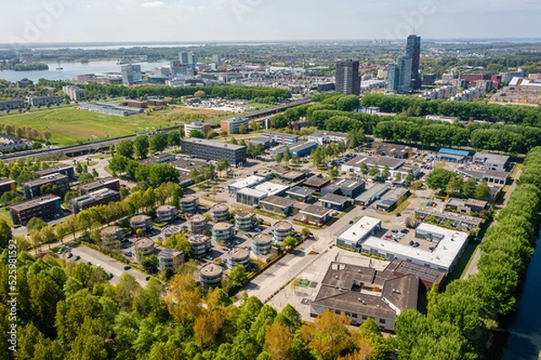 Obraz Almere city center with an office park on the foreground. Flevoland, The Netherlands. Aerial drone shot.