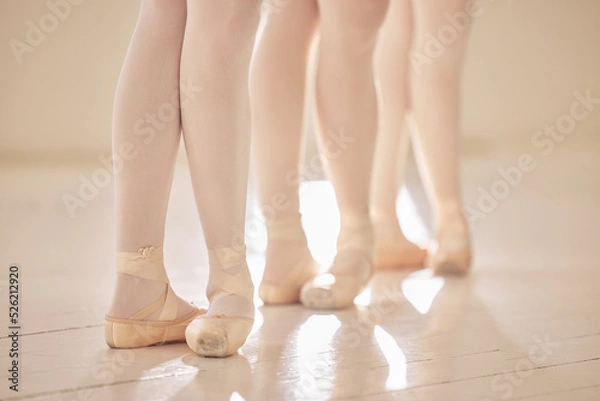 Fototapeta Ballet, feet or shoes of dancers dancing training and practicing for a performance in a studio. Closeup of an elegant, artistic and classy ballerina group or team preparing for a stage competition