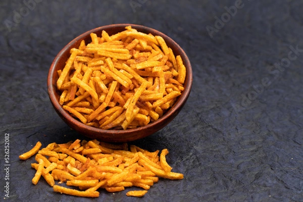 Fototapeta Indian Namkeen Kurkura Kacchi Aloo Sev Spicy Stick Bhujia Chips Or Kurkure Aaloo Seb Bhujiya Lachha Mixture Fryums Are Made Of Roasted Sliced Potato Deep Fried With Assorted Spices Garam Masala