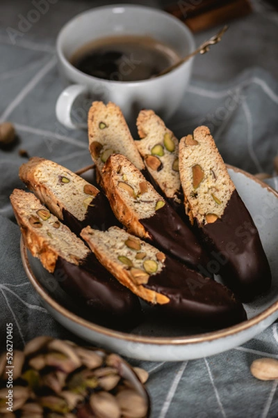 Fototapeta Biscotti or cantuccini with nuts on dark background