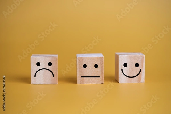 Fototapeta Customer service and Satisfaction concept happy Smiley face icon.Business feedback positive rating very impressed wood cube on table.