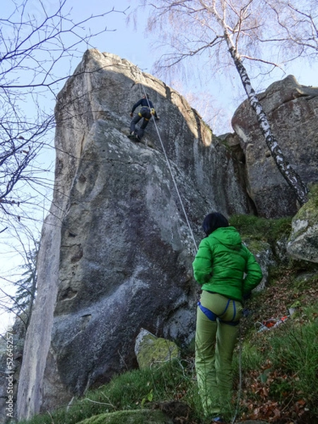 Fototapeta climber on a cliff