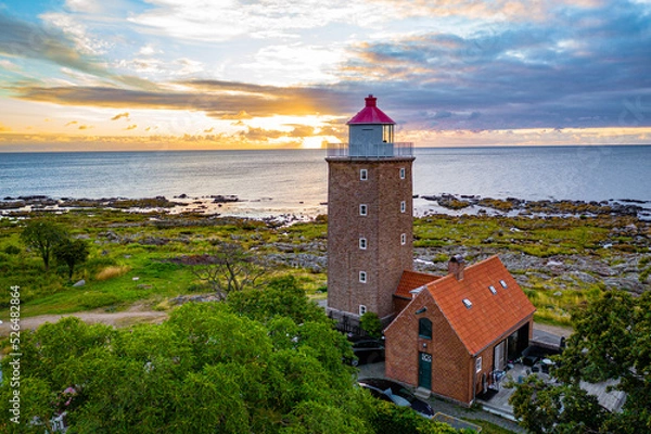 Fototapeta aerial view of lighthouse on the coast of the sea on bornholm denmark