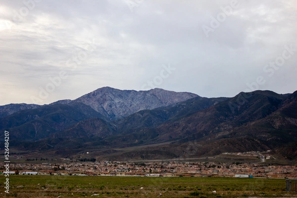 Obraz Landscape with mountains and clouds