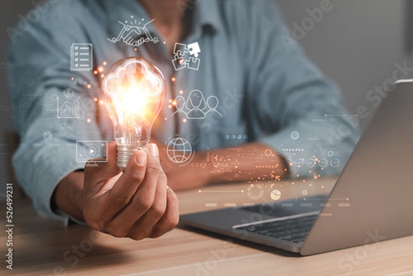 Fototapeta Hand holding light bulb with cloud computing icon and global internet connection technology. Global Business and Digital Marketing, Internet Connectivity, Finance and Banking. digital link technology