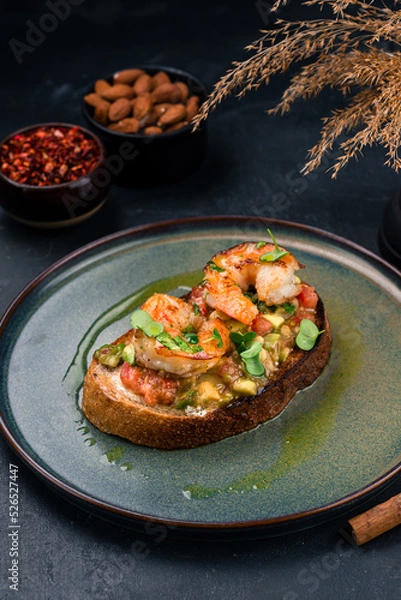 Fototapeta Bruschetta with shrimps and micro greens. Healthy eating concept