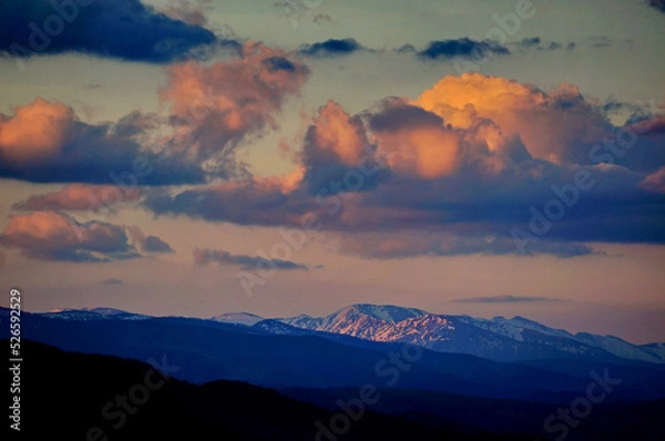 Obraz Dark mountainous landscape during late evening, with beautiful colorful and heavy clouds