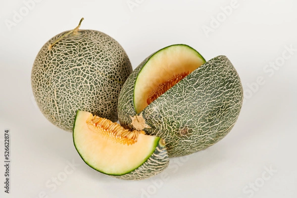 Obraz Sliced and whole cantaloupe on a white background