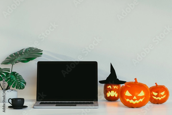 Obraz laptop with halloween pumpkins. 3D render