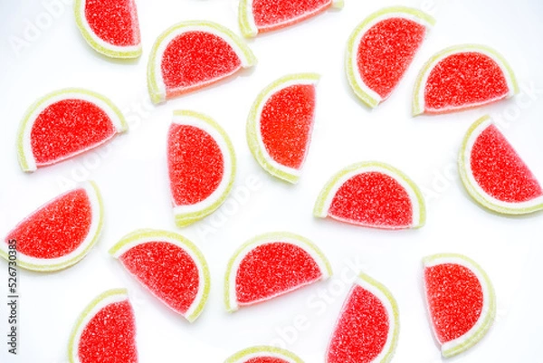 Obraz Jelly candies. Top view of watermelon jelly candies sprinkled with sugar on a blue background. Watermelon marmalade. Selective soft focus.Bright summer background.
