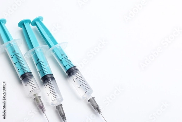 Obraz Medical syringe on a white background. A syringe for injection. The concept of health and beauty