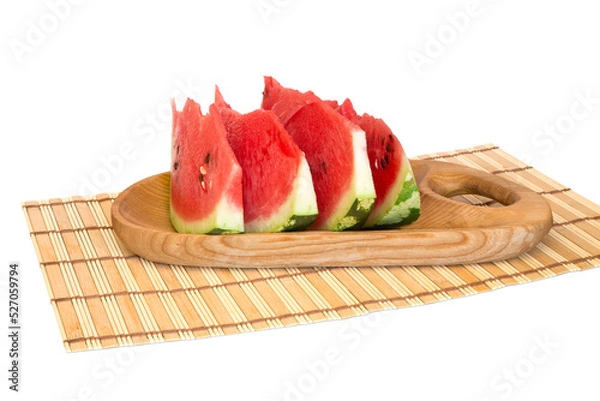 Fototapeta Slices of watermelon on a wooden board on a napkin isolated on white