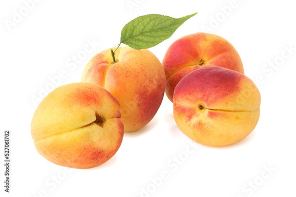 Fototapeta Apricots with leaf isolated on white