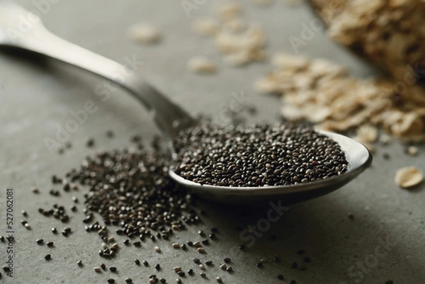 Fototapeta Healthy Chia seeds in a spoon on the table close up.