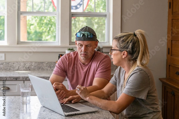 Fototapeta Marine veteran at home with family on a early morning in the kitchen.