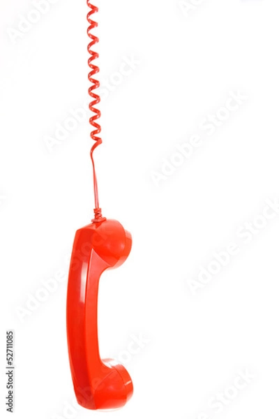 Fototapeta Isolated dangling red retro telephone receiver on white