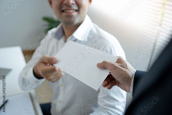 Fototapeta Businessmen receive salary or bonuses from management or Boss. Company give rewards to encourage work. Smiling businessman enjoying a reward at the desk in the office.