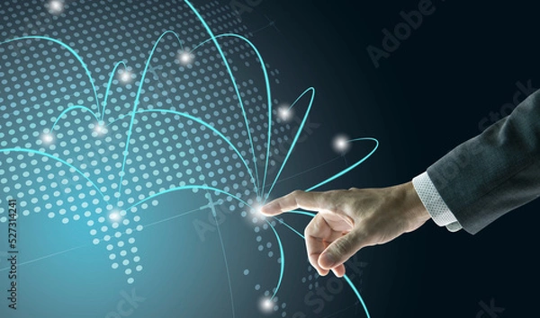 Fototapeta Right hand of a businessman touching digital globe to show business network growth to world wide