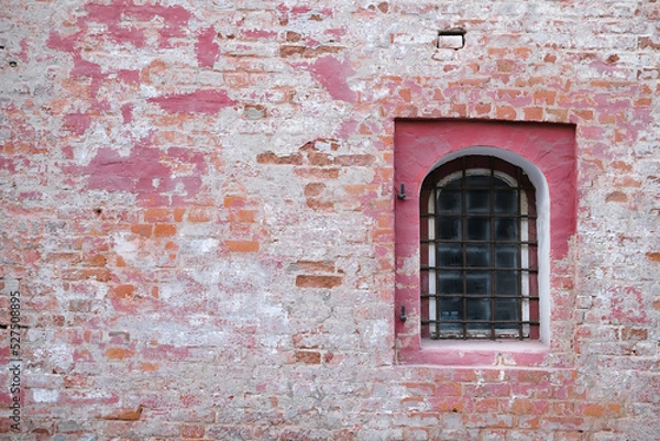 Fototapeta Brick old wall with a window with bars