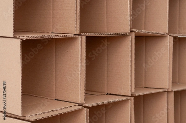 Obraz Cardboard boxes stacked in a pile. Background Texture