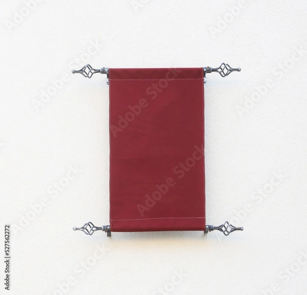 Fototapeta Blank canvas poster post on the wall. Vintage maroon red sign with copy space. medieval inscription for building