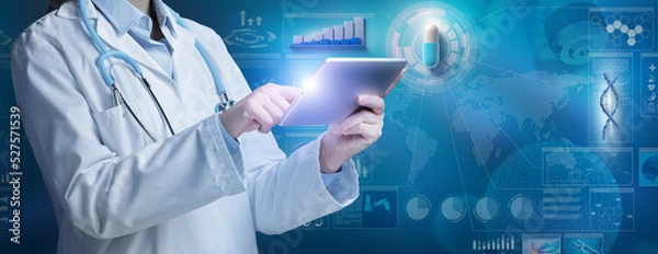 Fototapeta Female doctor in white coat and stethoscope tapping on digital tablet in a scientific blue background with capsule, diagram, chart and infographics. Pharmaceutical industry research and development.