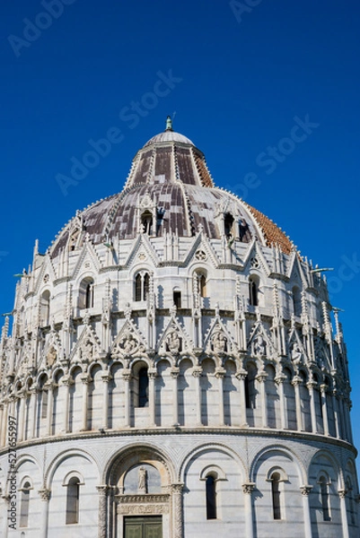 Fototapeta Pisa, Tuscany, Italy 08-28-2022. Details the architecture of the Pisa Baptistery, dedicated to Saint John the Baptist, faces the cathedral at the western end of the Piazza dei Miracoli.