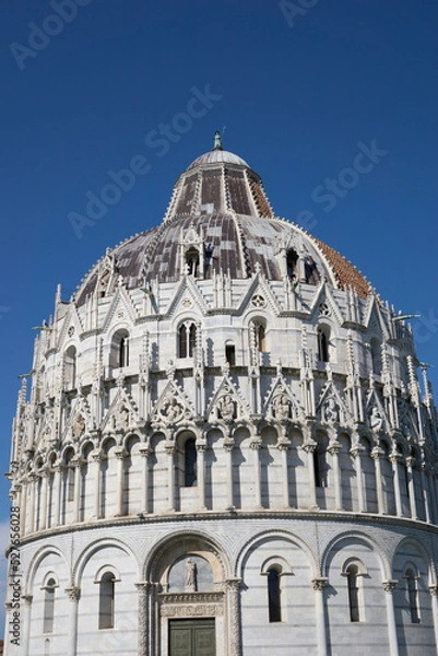 Fototapeta Pisa, Tuscany, Italy 08-28-2022. Details the architecture of the Pisa Baptistery, dedicated to Saint John the Baptist, faces the cathedral at the western end of the Piazza dei Miracoli.