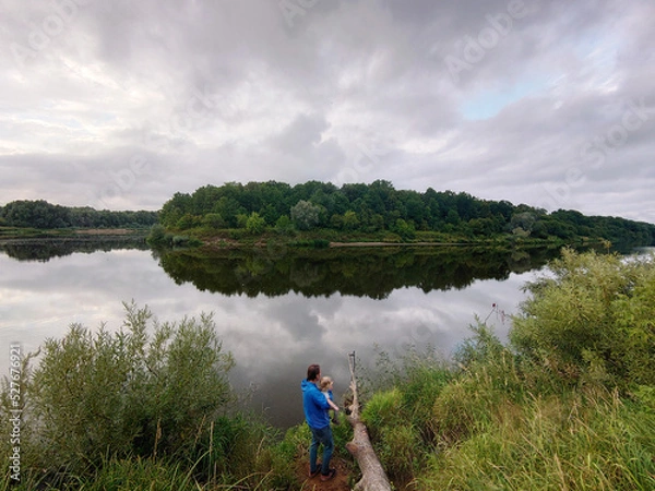 Obraz Forest river view summer landscape. Beautiful wild nature scene with water and oak trees on the shore. Klyazma, Vladimir Oblast, Russia. Cloudy weather, rain clouds
