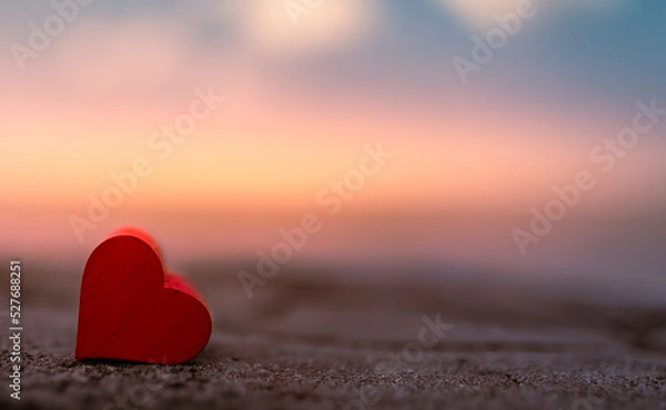 Obraz Heart isolated on colorful sunset nature view. Love and romance concept. 