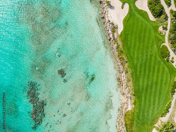 Fototapeta aerial view of golf course on the water