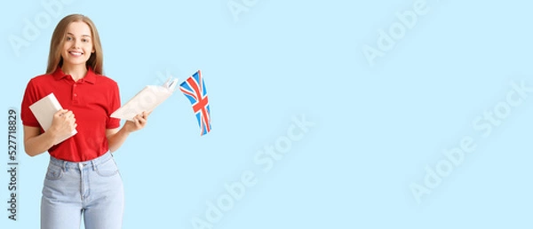Obraz Young female student with UK flag and books on light blue background with space for text