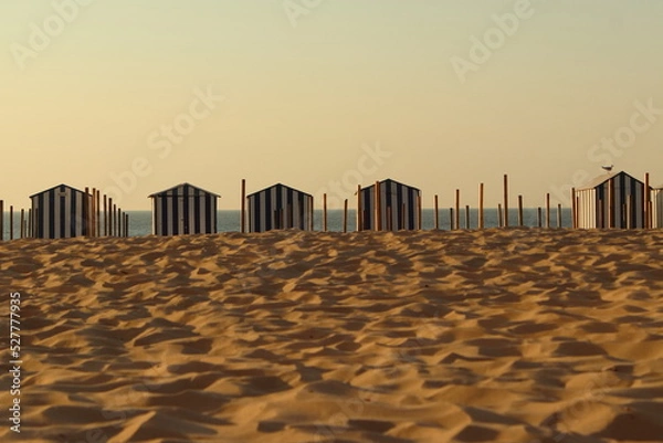 Obraz Sandy beach with changing cabins