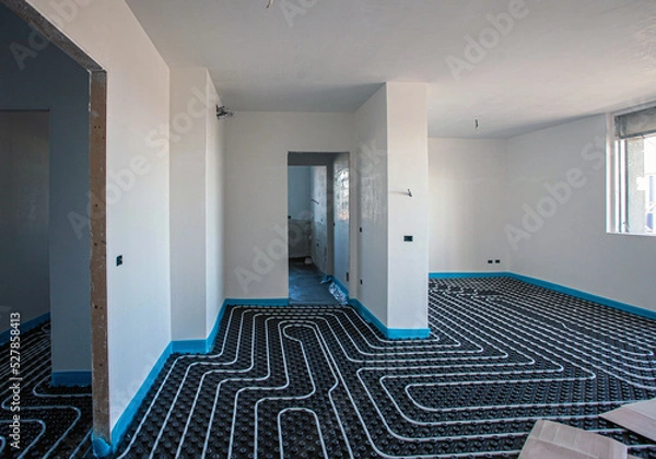 Fototapeta Underfloor heating. Underfloor heating system in a modern building under construction.