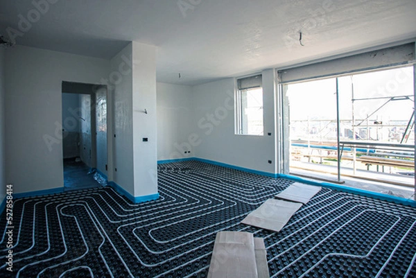 Fototapeta Underfloor heating. Underfloor heating system in a modern building under construction.
