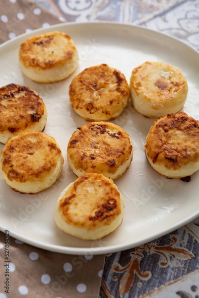 Fototapeta Close up of fresh cheeese pancake fritters breakfast food