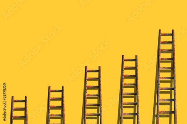 Obraz ladders on yellow wall ,competition concept