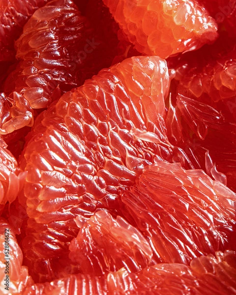Fototapeta CLose-up of peeled red grapefruit segments