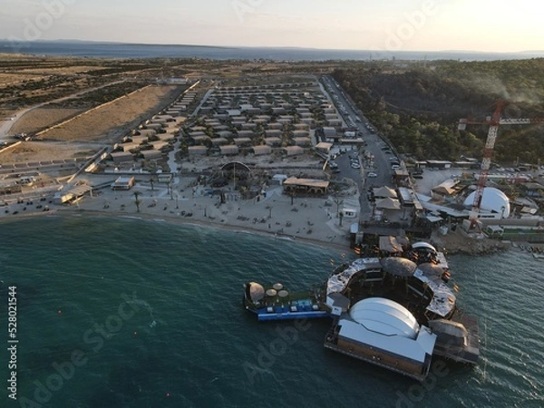Obraz Aerial view of Zrce Beach Festival in Novalja, island Pag, archipelago of Croatia. People partying on a hot summer day on Zrce beach. Zrce beach is the most popular party destination on Adriatic sea.