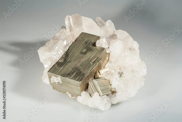 Fototapeta A sample of a natural mineral crystal iron pyrite (sulfide class) fusion on quartz druze untreated crystalline pyrite, fool's gold. Museum Mineral Series. Mineralogical sample