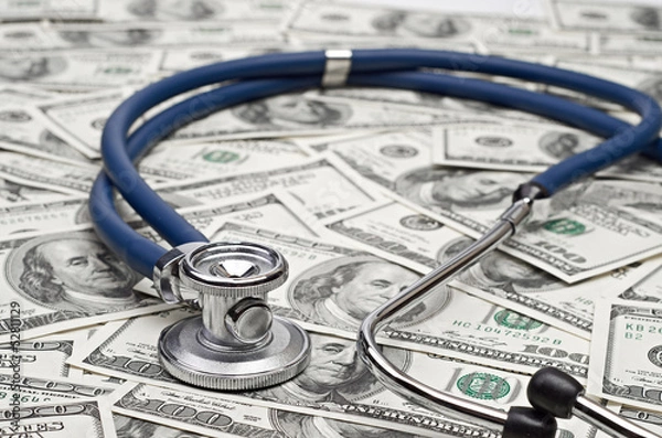 Fototapeta heap of dollars with stethoscope