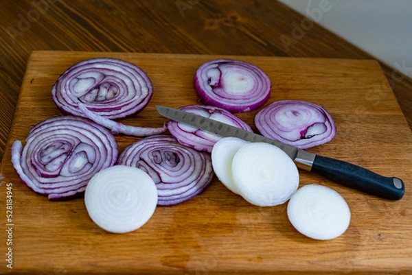 Obraz sliced onions on a wooden cutting board