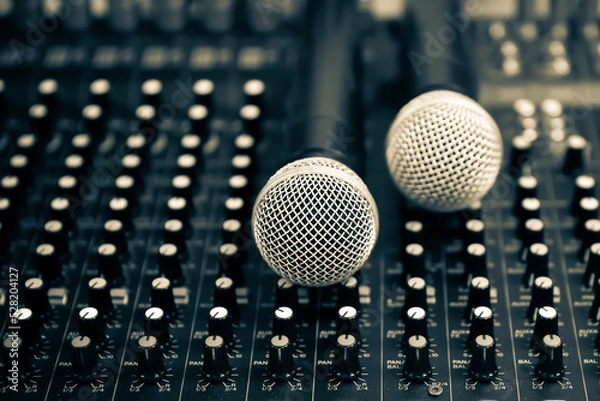 Fototapeta Close-up microphone and sound mixer in studio for sound record control system and audio equipment and music instrument