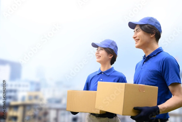 Fototapeta メインビジュアルにも！街と引っ越しやさんのイメージ	