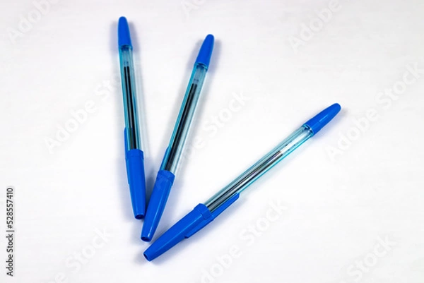 Obraz 3 ballpoint pens on a white background. close-up, selective focus.