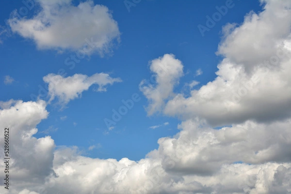 Fototapeta White, fluffy clouds in blue sky. Background from clouds.